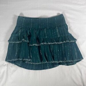 green skirt with silver detailing and ruffles